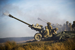 Royal Artillery firing 105mm Light Guns on exercise